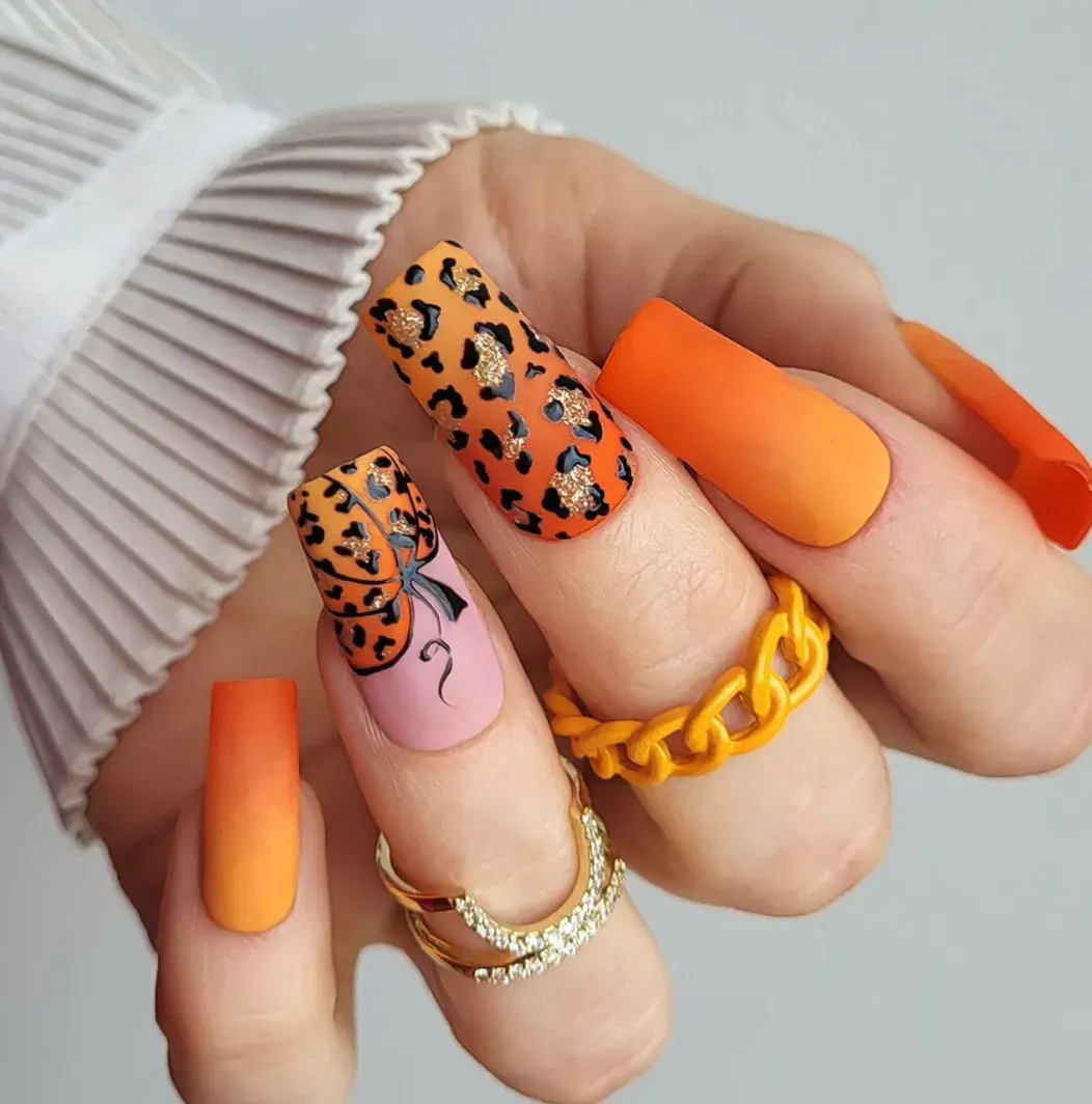 Ombre orange nails with bold leopard print and a pumpkin accent? Yes, please. This set is trendy, fierce, and perfect for anyone who wants their October nails to stand out.