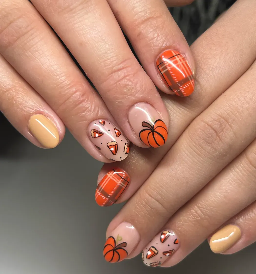 Orange plaid nails paired with bold pumpkin art make this manicure a standout for both Halloween parties and pumpkin patch trips. It’s fun, bold, and totally October.