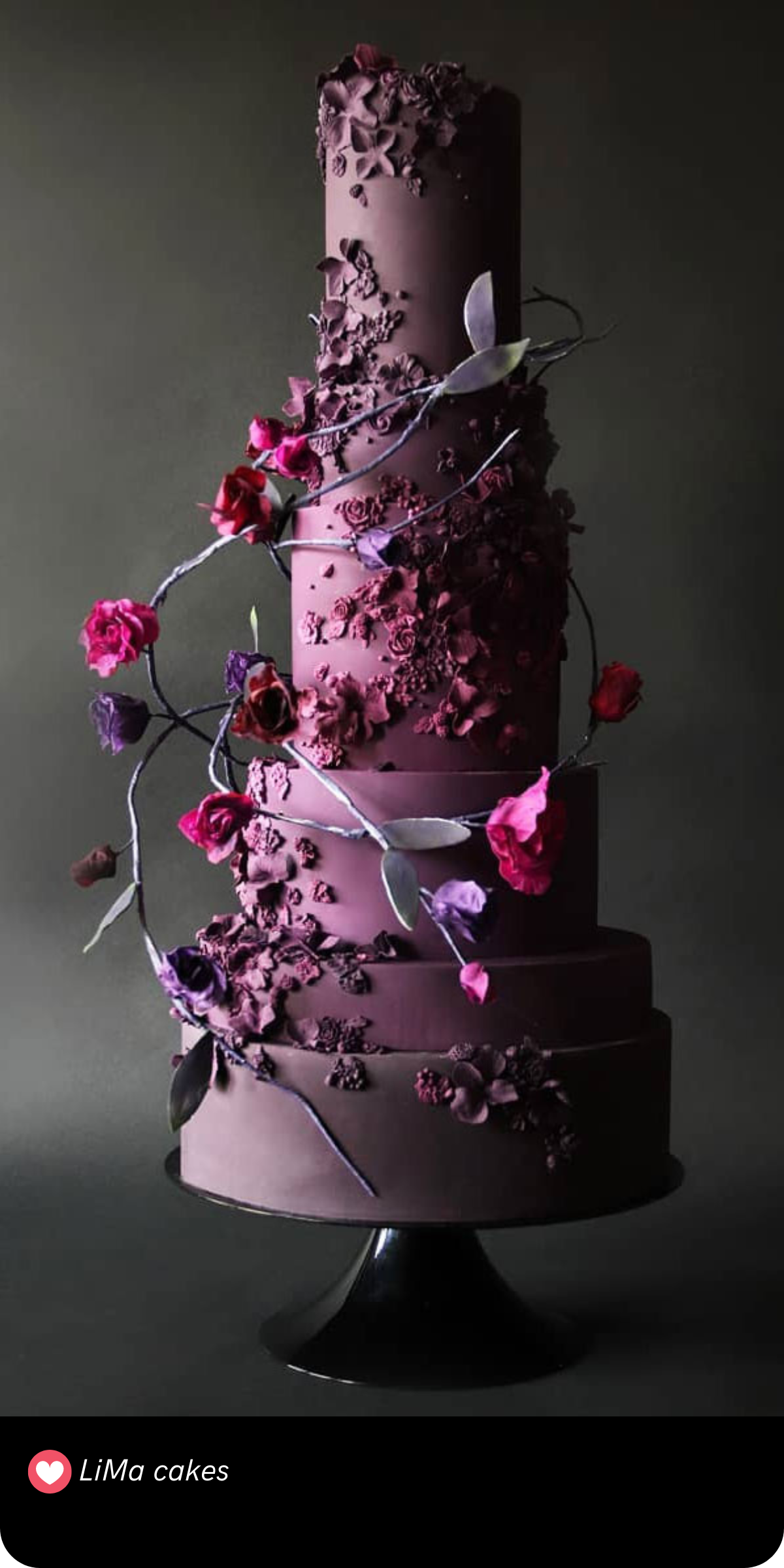 Dark and moody never looked so good. This cake's deep, almost gothic purple is brought to life by a winding vine of bold burgundy flowers, perfect for a mysterious, romantic celebration.