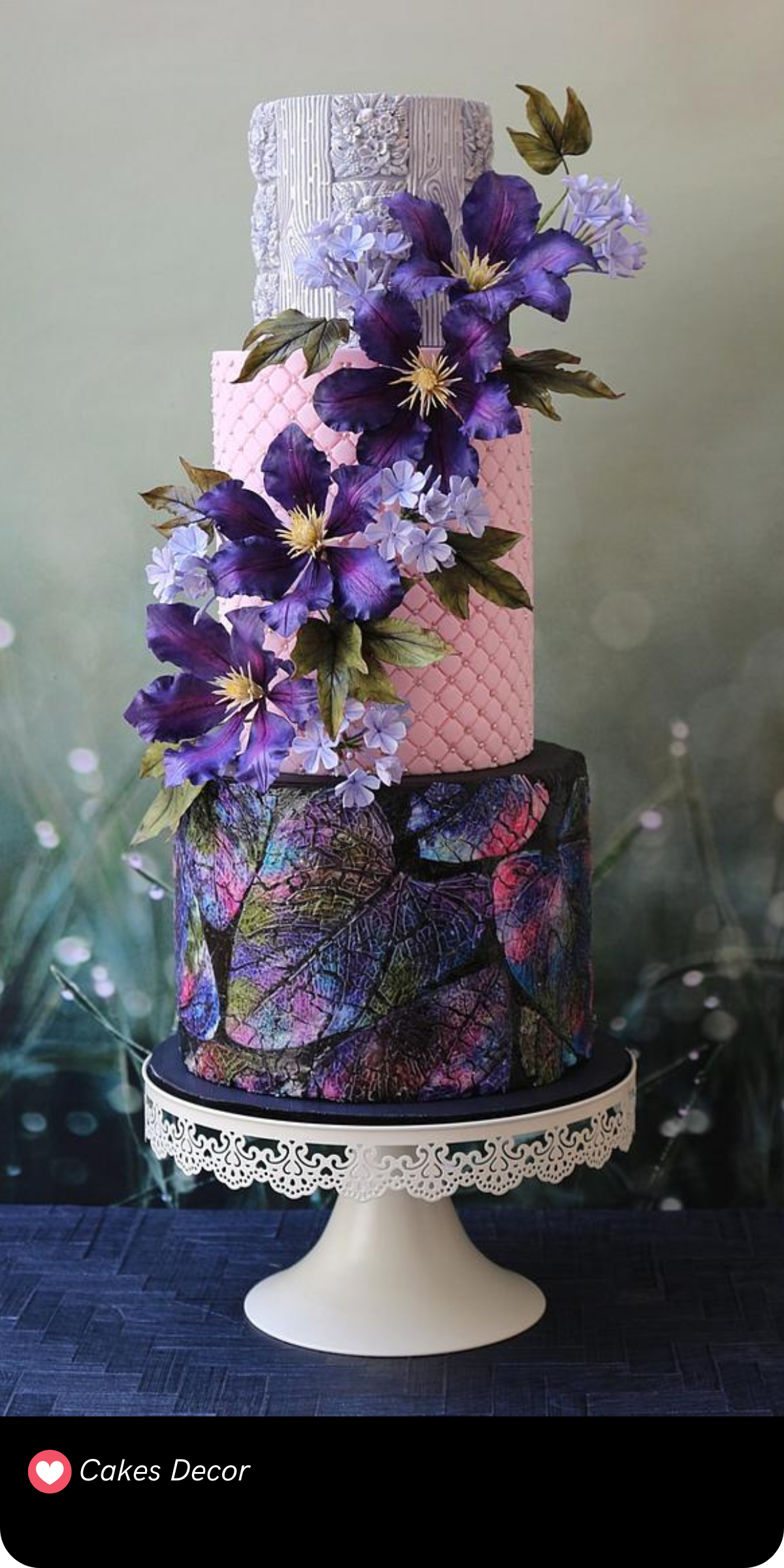 This towering confection combines intricate texture and layers of purple florals with modern design, creating a fairytale-inspired cake that’s both elegant and enchanting.