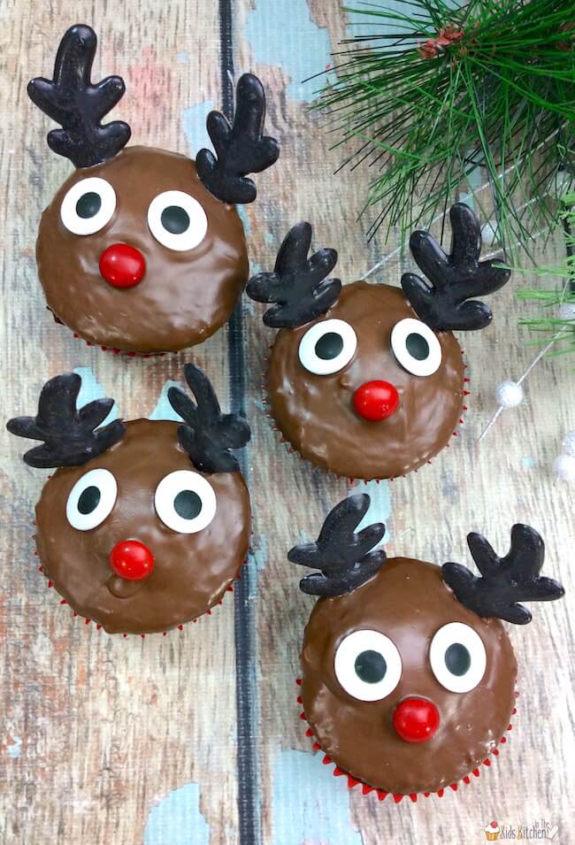 Bring Rudolph to life with these adorable cupcakes featuring pretzel antlers and a red nose. Kids will love these as a fun holiday activity or treat!