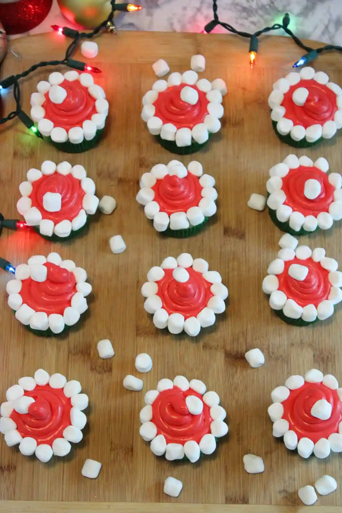 Topped with bright red frosting and a cute white "pom-pom," these cupcakes look just like Santa's hat! A fun and festive treat that's sure to bring smiles.