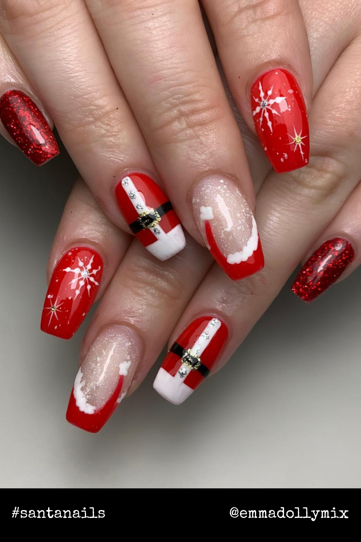 Elegant Santa Chic: This design features Santa suits with rhinestone belts, snowy accents, and plenty of sparkle. It's a polished take on Santa nails for a festive yet classy look.