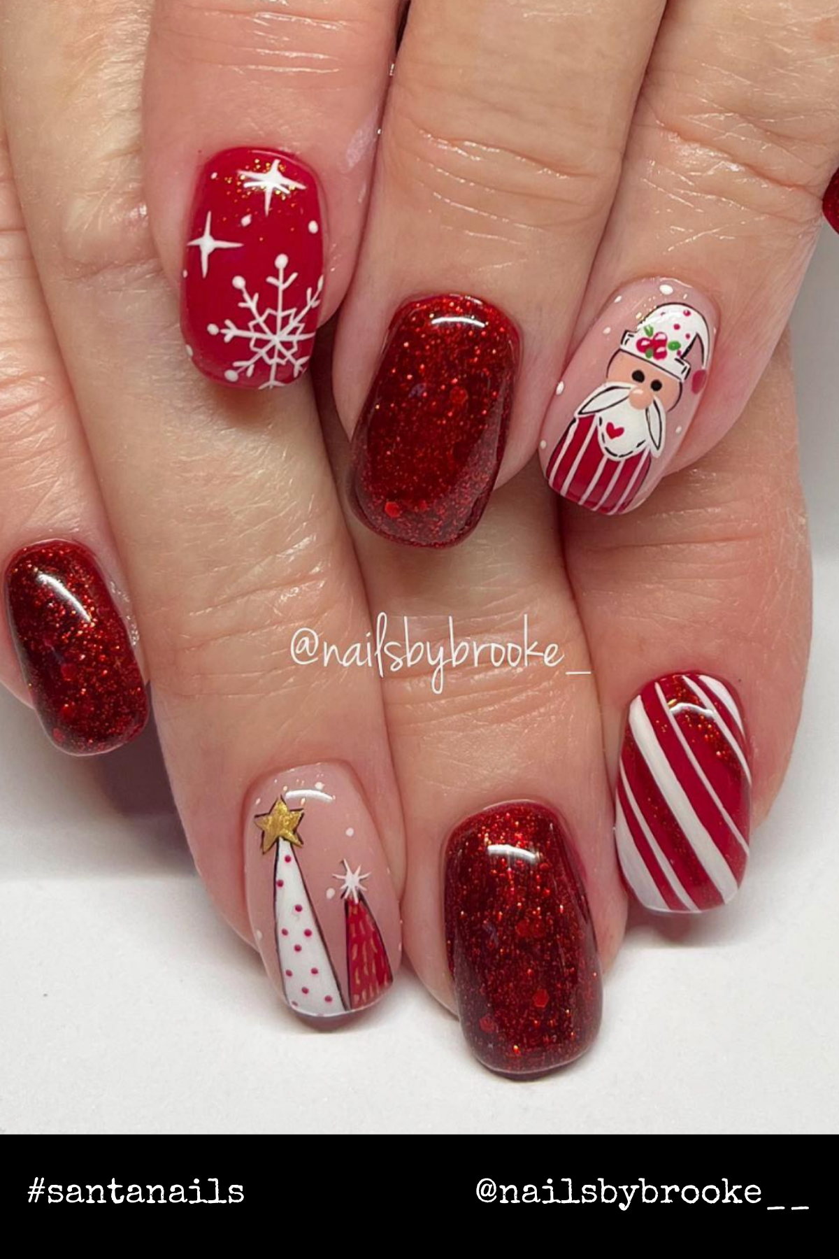 Glittery Santa Wonderland: From sparkly red polish to Santa, snowflakes, and candy cane stripes, this set screams merry Christmas nails for anyone who loves festive nail art.