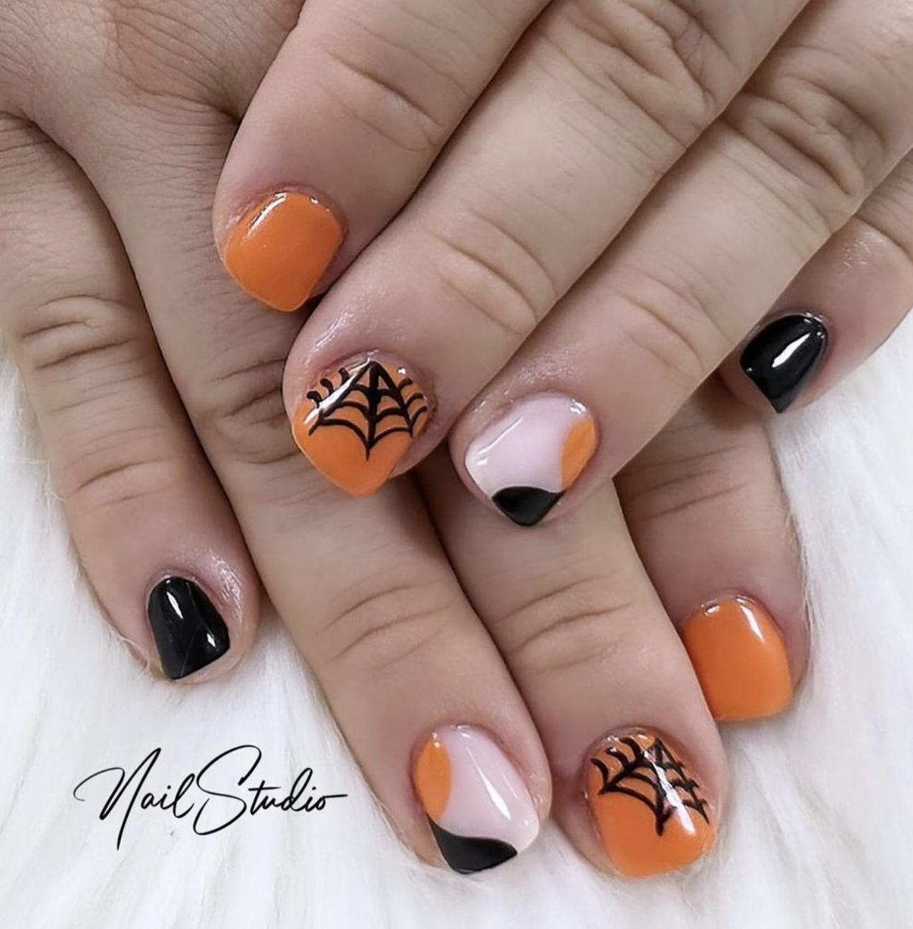 @nailstudioaolonia - These Halloween nails are a fun and playful mix of classic spooky colors with some modern, geometric twists! The design perfectly balances festive Halloween elements with stylish patterns that make the nails stand out without being overly complicated.