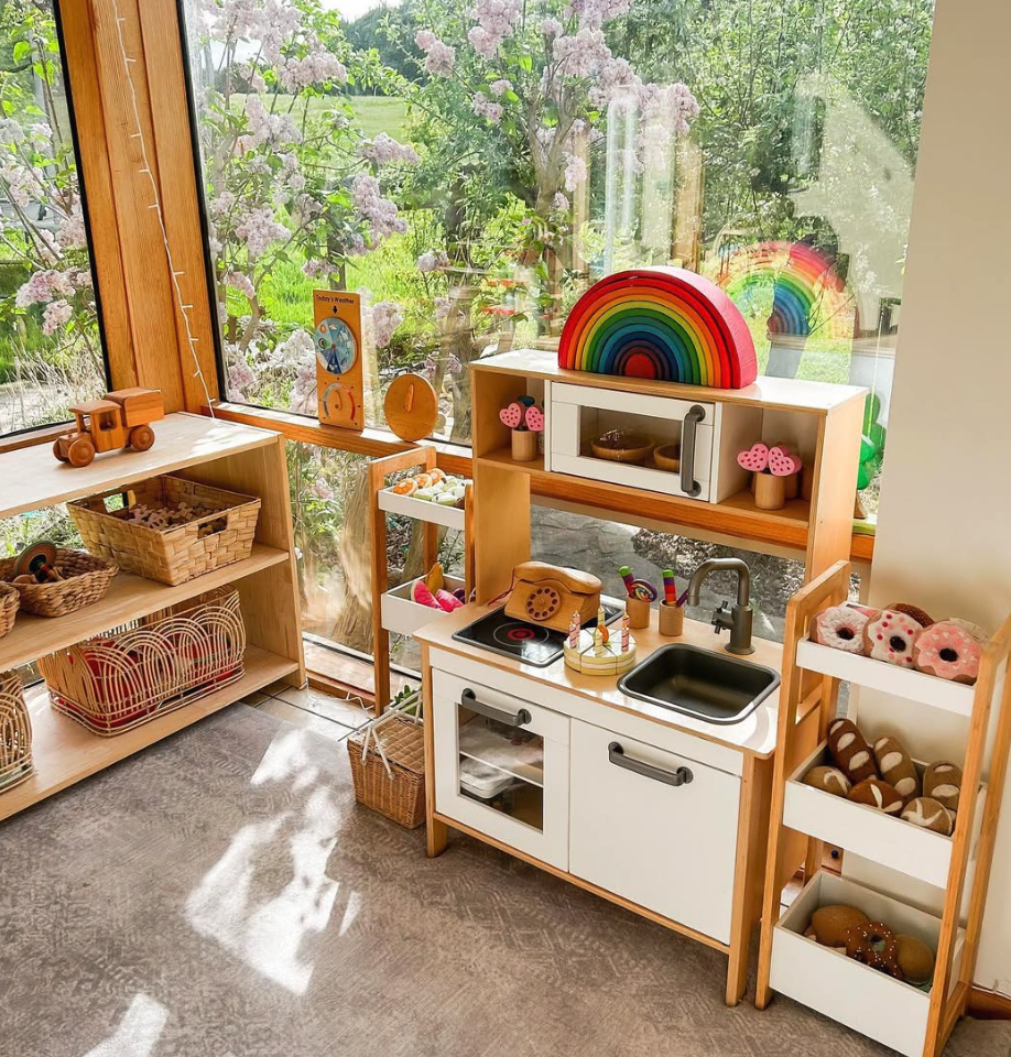 Themed play zones are a fantastic way for kids to engage in imaginative play. This playful space, complete with a mini kitchen and colorful blocks, encourages creativity and social interaction. It's a cozy spot where little ones can express themselves while having fun!