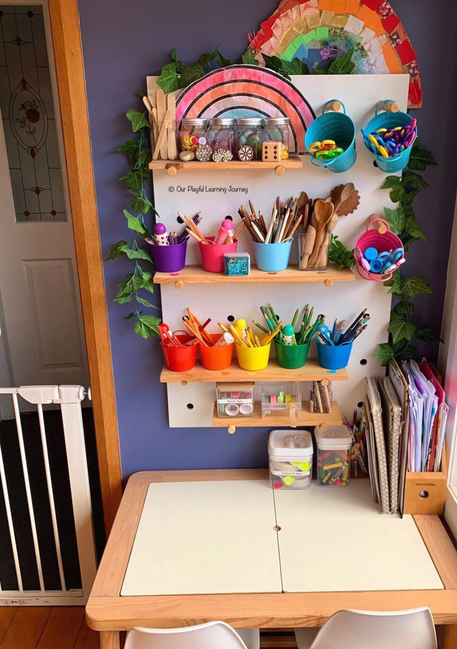 This little art space is bursting with creativity! The walls are adorned with colorful artwork, showcasing the imagination of young artists. A cozy chair and messy table invite anyone to grab some supplies and let their creativity flow.