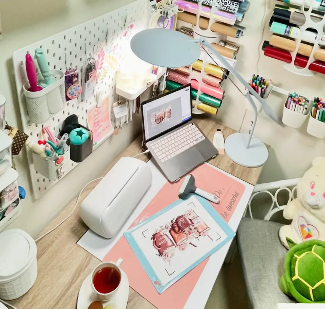 This small desk nook makes the most of vertical space with a pegboard for tools and shelving for ribbons and jars. The mounted tablet adds a modern, tech-savvy touch!