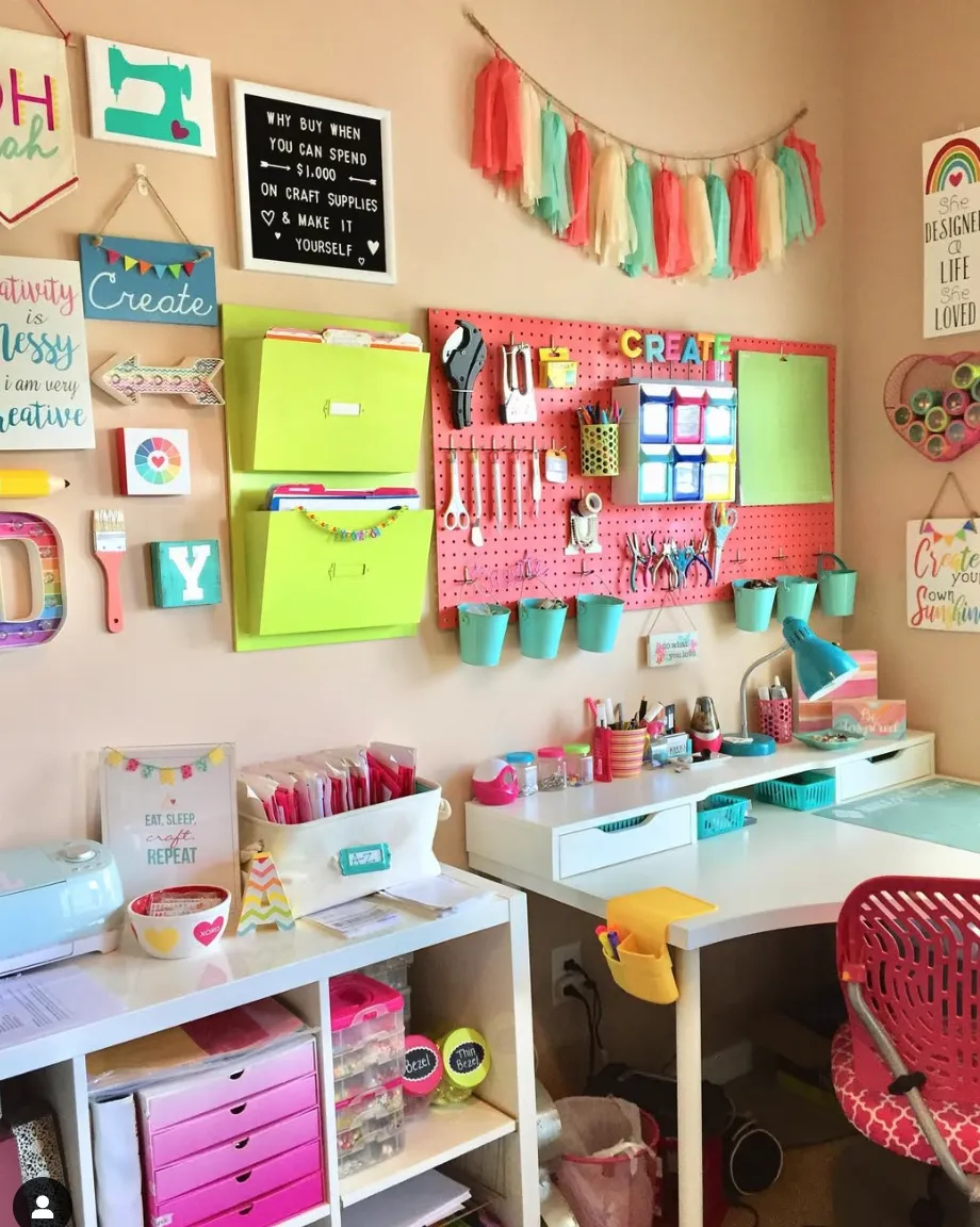 Bright and cheerful! This pink pegboard offers a pop of color and plenty of room for craft tools, while the attached buckets keep smaller supplies tidy and accessible.