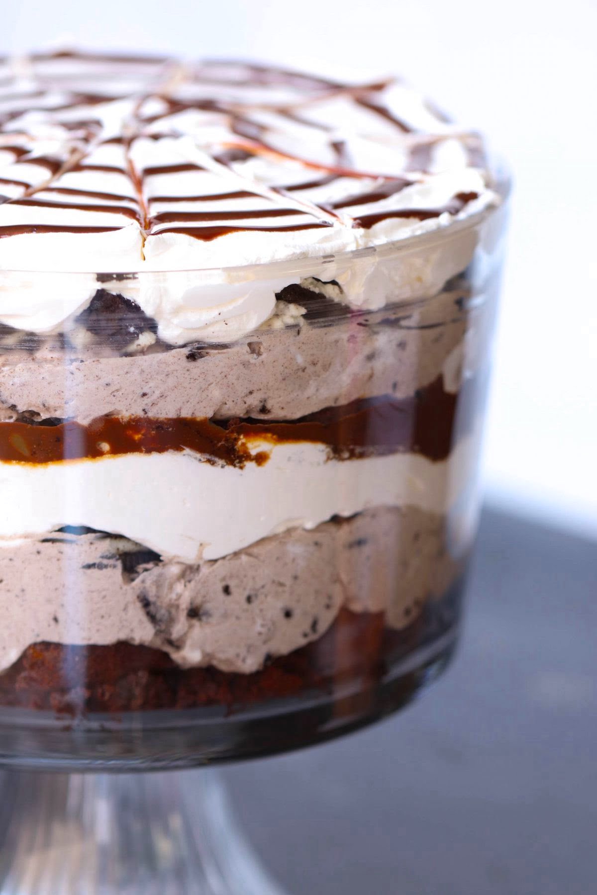 Oreo lovers, this one’s for you! This trifle has layers of Oreo cheesecake filling, crumbled cookies, and whipped cream. Topped with spooky candy decorations, it’s a simple yet stunning dessert that’s sure to be a hit with both kids and adults.