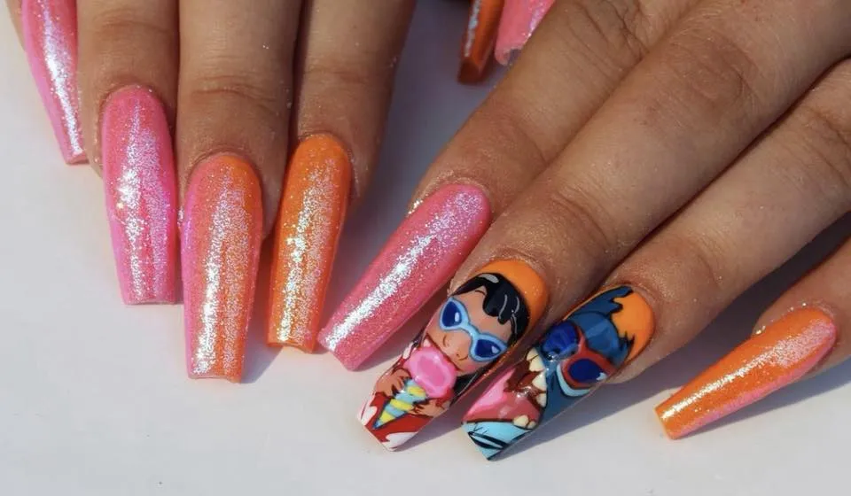 Sweet and simple, these glossy Stitch nails combine soft ornage and pink shades with tiny character accents for a cute and easy Disney mani you could totally wear year-round.