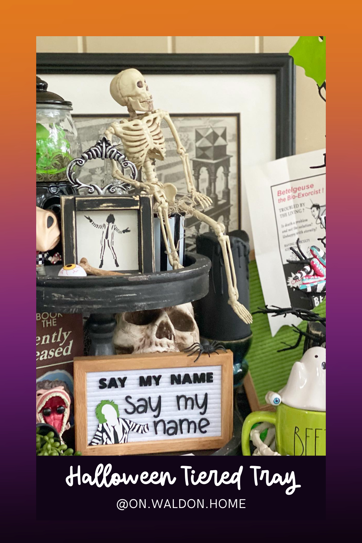 A spooky skeleton takes center stage in this Beetlejuice-inspired display, surrounded by eerie décor like the "Say My Name" sign, a mini skull, and a touch of ghoulish green – a must-see for fans of the ghost with the most!