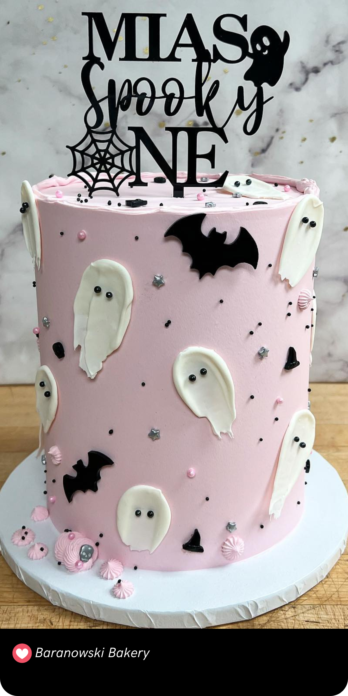 This cute "Spooky One" smash cake is perfect for a first birthday! With soft pink icing decorated with charming ghosts and bats, it’s spooky yet sweet. The playful topper adds just the right touch for a cute Halloween birthday celebration.