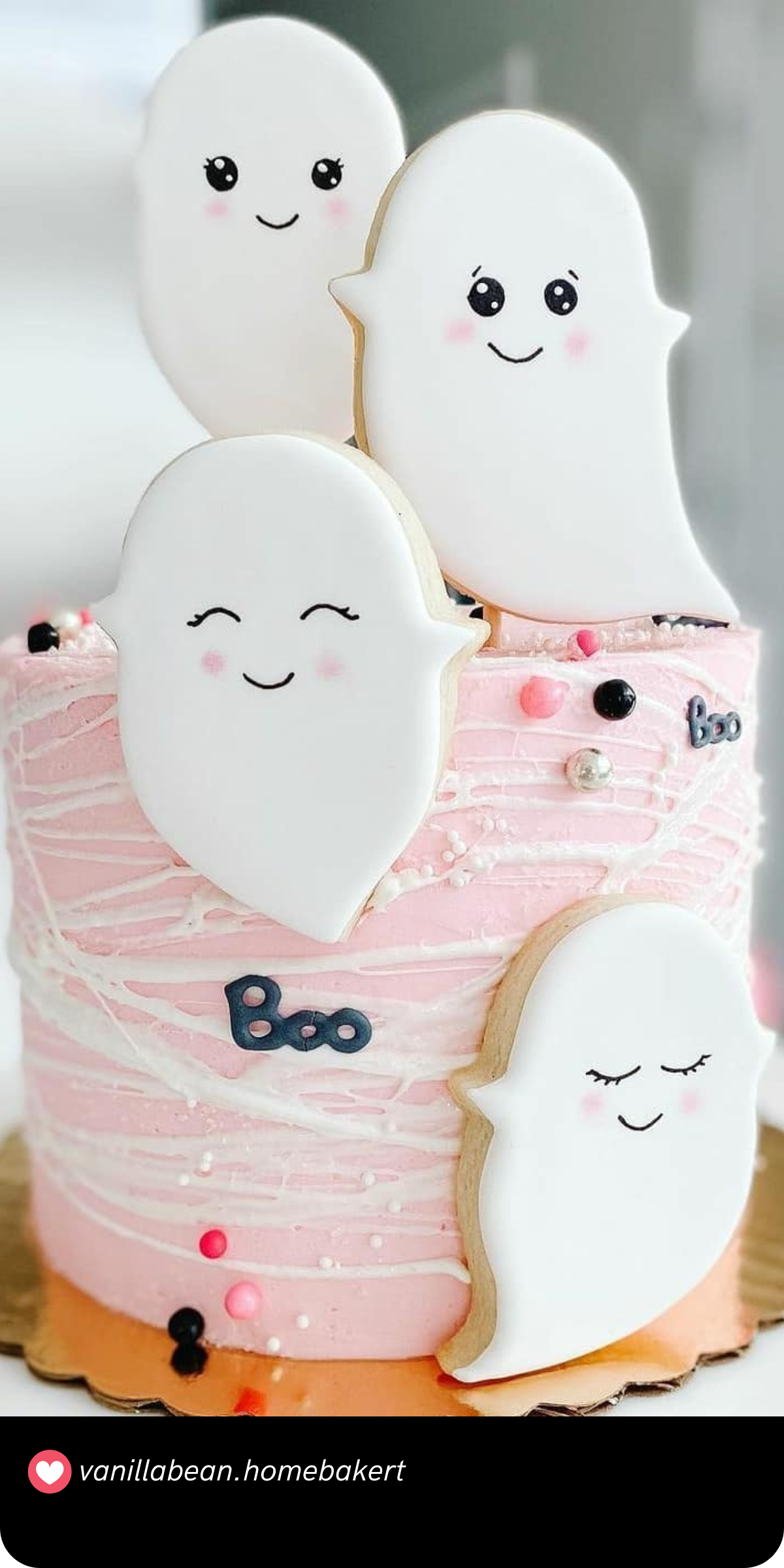 How precious are these smiling ghost cookies? This adorable first birthday cake, draped in pink and white, mixes cute and spooky with its friendly ghost decorations, making it a perfect pick for a "Spooky One" celebration.