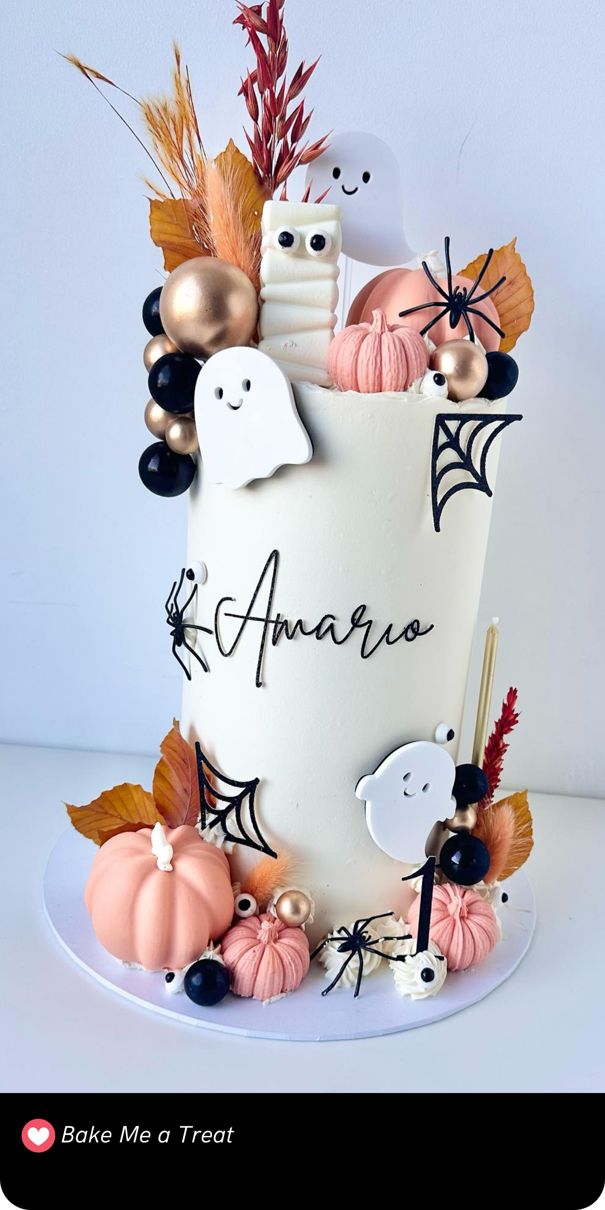 This whimsical "Spooky One" celebration cake is dressed in autumnal charm with mini pumpkins, happy ghosts, and even a cute little mummy! A gorgeous pick for a first birthday Halloween party.