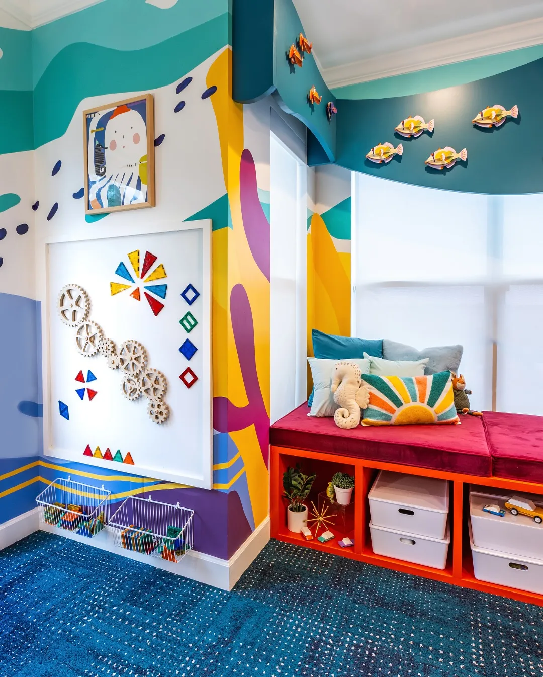 Under-the-Sea Adventure Nook – A vibrant playroom with an interactive wall, bold murals, and cozy built-in seating, perfect for sparking creativity in a small space.