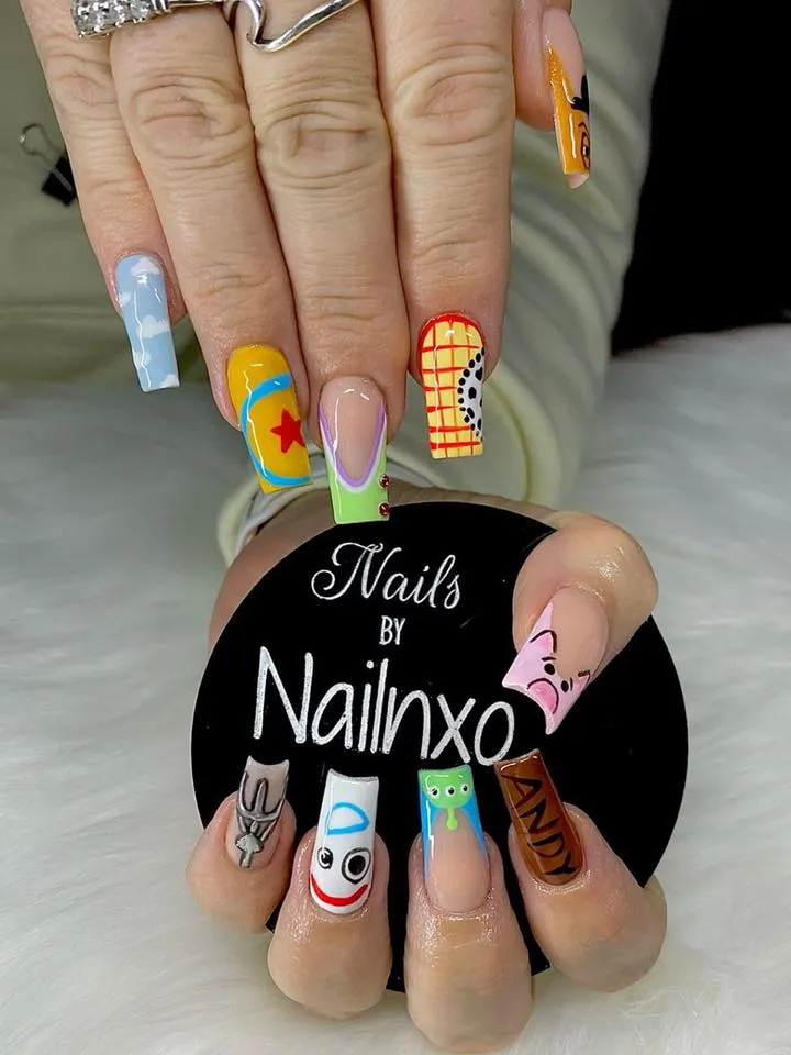 These playful Toy Story nails bring all your favorite characters to life — from Woody’s cowboy print to Buzz’s bright green and purple suit. Perfect for Disney lovers who aren’t afraid of bold colors and nostalgic charm.