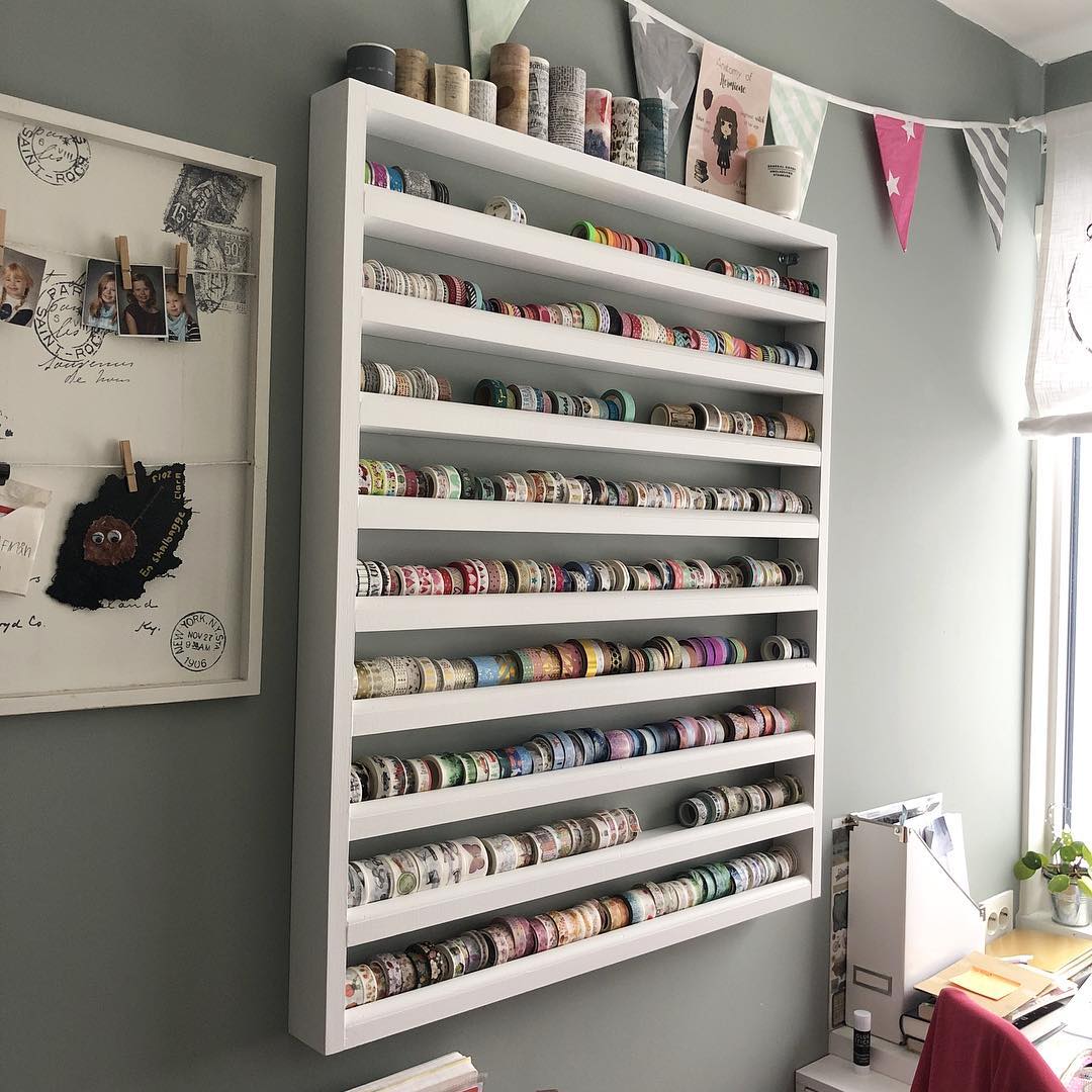 Washi tape heaven! 🎨✨ This wall-mounted shelf is a genius way to keep your collection organized and beautifully displayed. No more digging through drawers—just grab and craft!