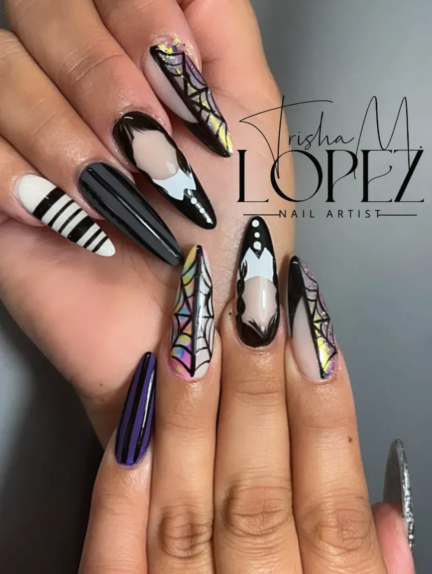 Long almond nails make the perfect canvas for this look — crisp stripes, intricate webs, and a bold black polish that gives off serious Addams Family energy.