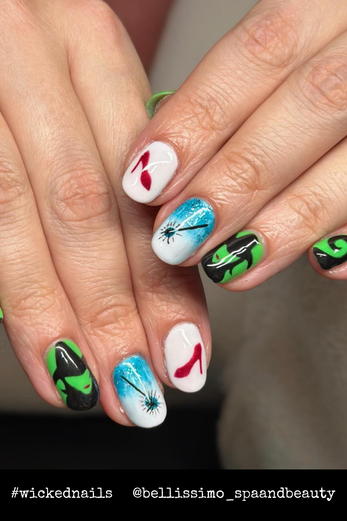 Vibrant hand-painted designs featuring Elphaba, Glinda’s wand, ruby slippers, and flowing green swirls celebrate iconic moments from the story.