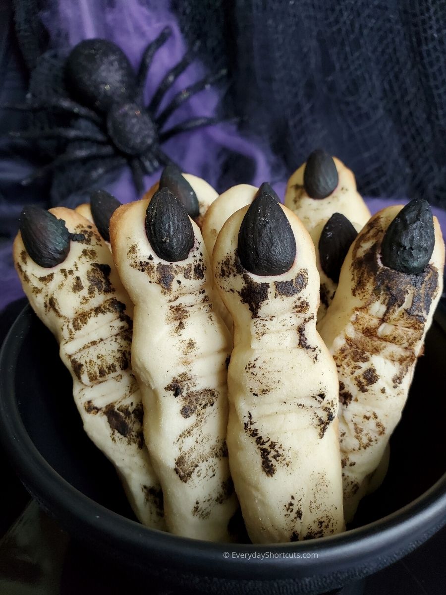 These almond-topped cookies are delightfully creepy, with a shape and color that scream witchy magic. A Halloween classic thatâs equal parts eerie and tastyâguaranteed to make your dessert table unforgettable.
