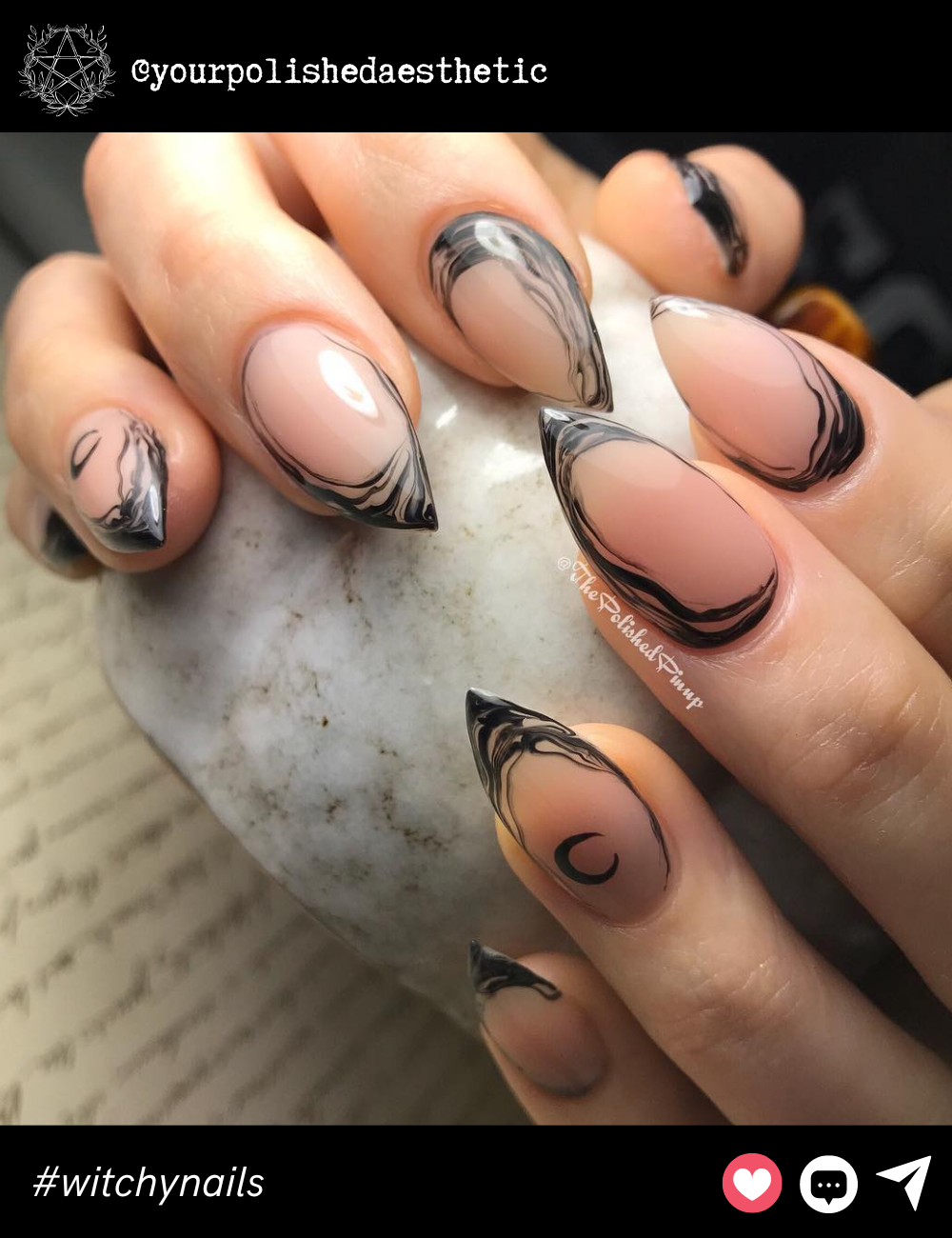 Marble Swirl Witchy TipsThese medium almond nails showcase a nude base with hypnotic black marble swirls at the tips. The subtle crescent moon detail brings the look together, adding a modern, witchy touch without going over the top.