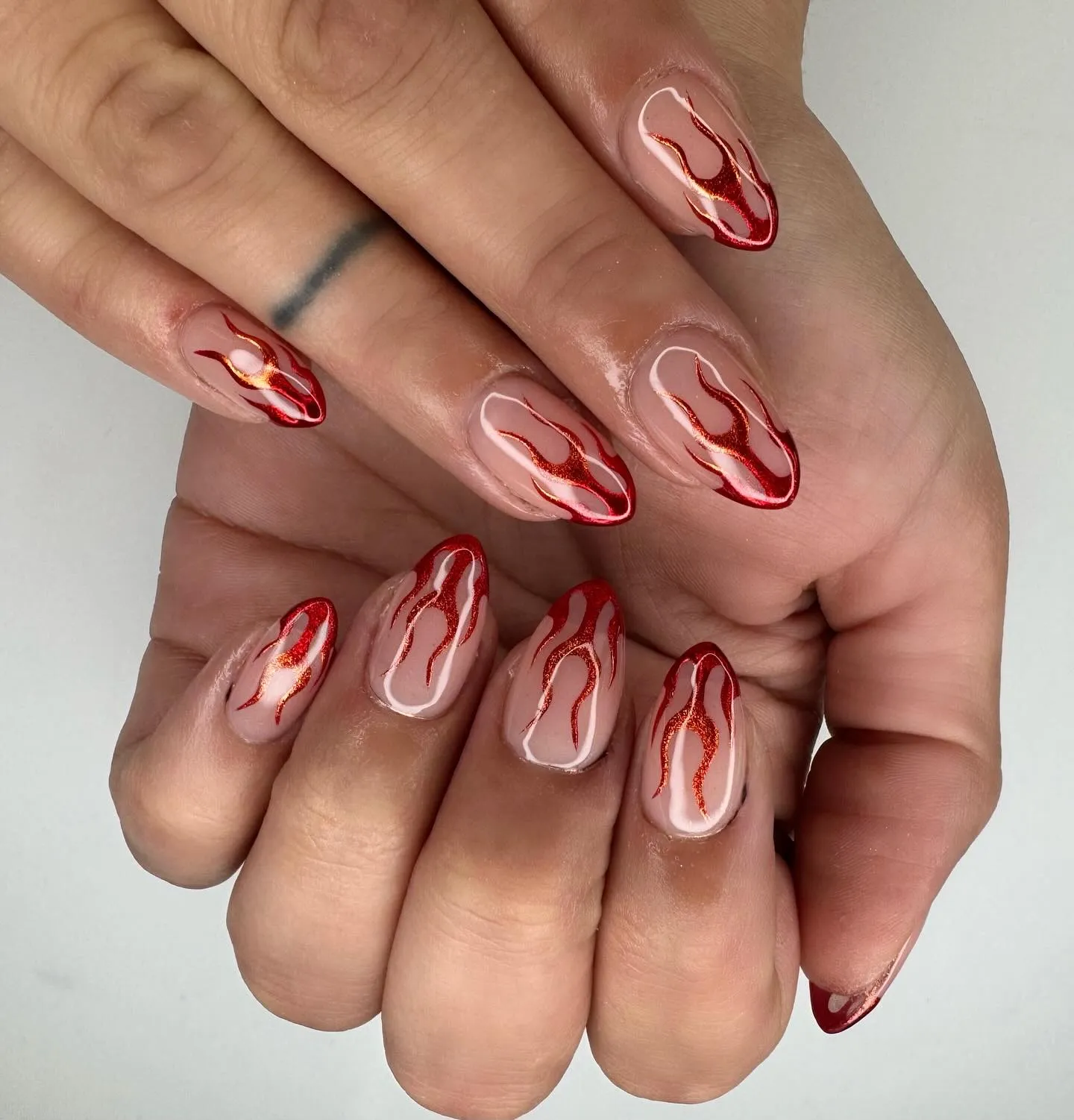 And rounding things off, @allyssapower created the ultimate red-and-orange ombré flames that look like they’re in motion. A bold choice for anyone who loves a slay-nails moment.