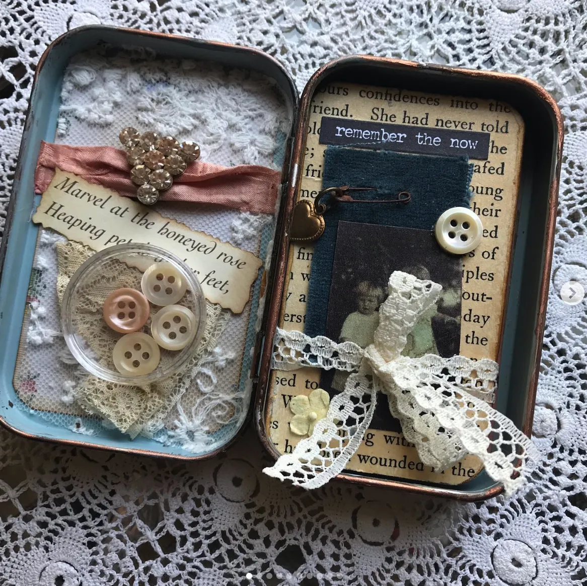 A vintage-inspired keepsake tin, adorned with lace, buttons, and a nostalgic photograph—perfect for those who cherish handmade memories.