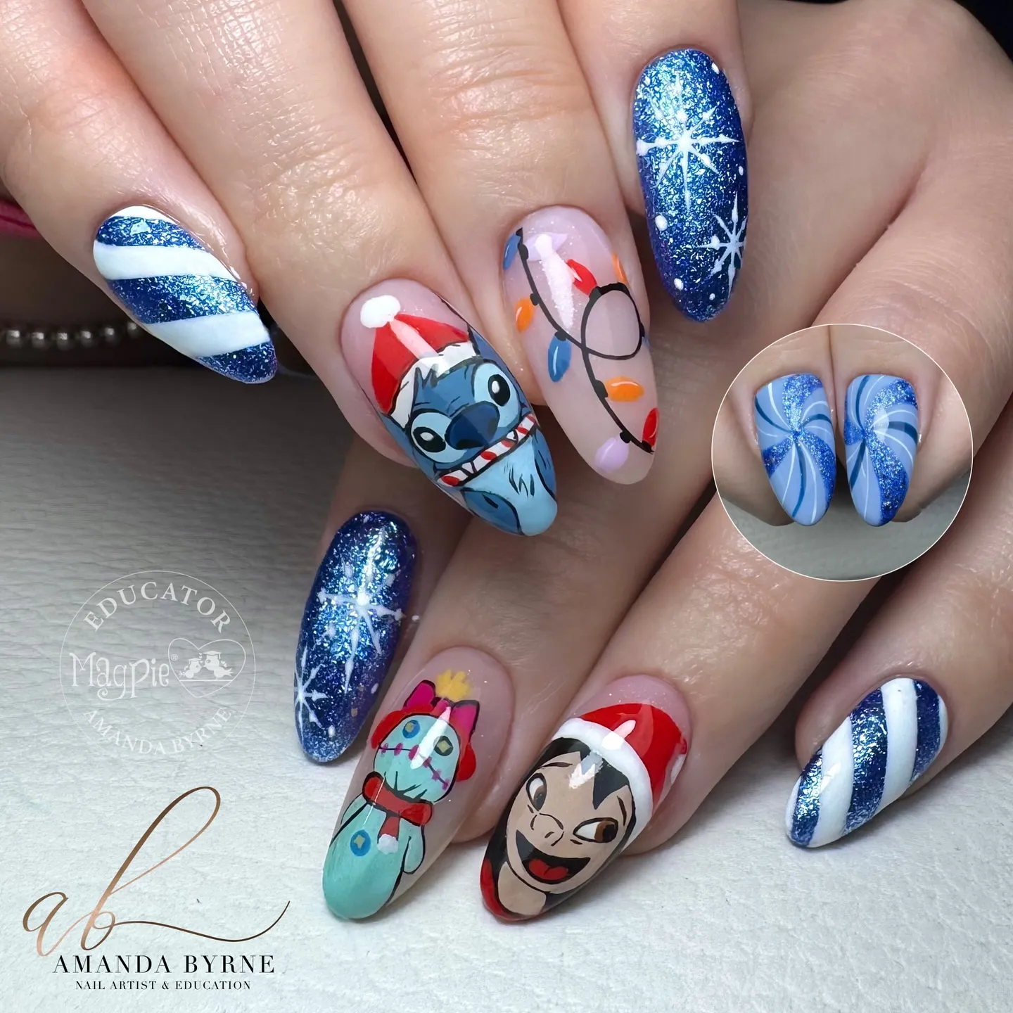 And finally, these Disney Christmas nails by @amanda_byrne_nailartist_ mix sparkle and character art beautifully. Featuring Stitch and Lilo in Santa hats with twinkly lights and glittering blue polish, they’re the perfect blend of Christmas nails inspiration and Disney magic.