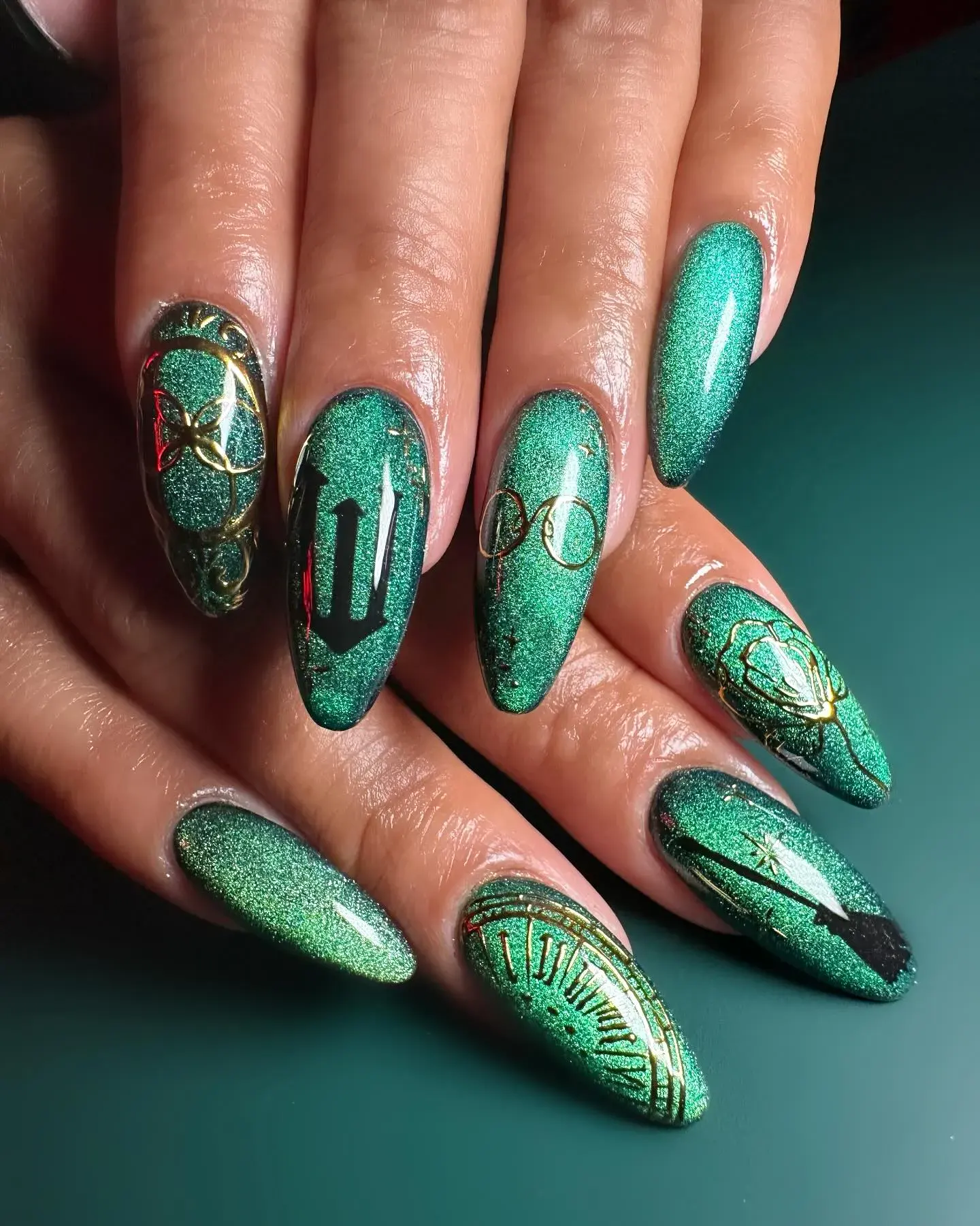 Rich green shimmer, gold accents, and spell-like symbols bring a dramatic Elphaba energy — a bold choice for anyone ready to defy gravity.