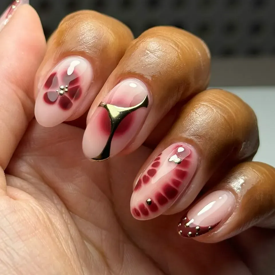 Deep wine tones with a soft chrome sheen and gold accents — rich, romantic, and perfect for sweater weather.