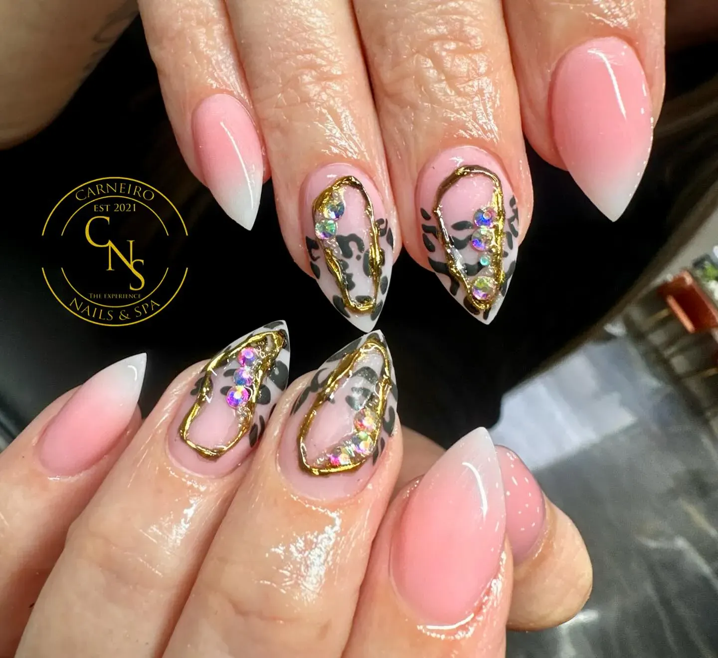 These elegant cheetah print nails feature gold framing and crystal accents for a high-fashion vibe. The soft ombré base keeps them feminine while the black spots add just the right edge. Perfect for cheetah print acrylic nails or anyone craving a little drama.