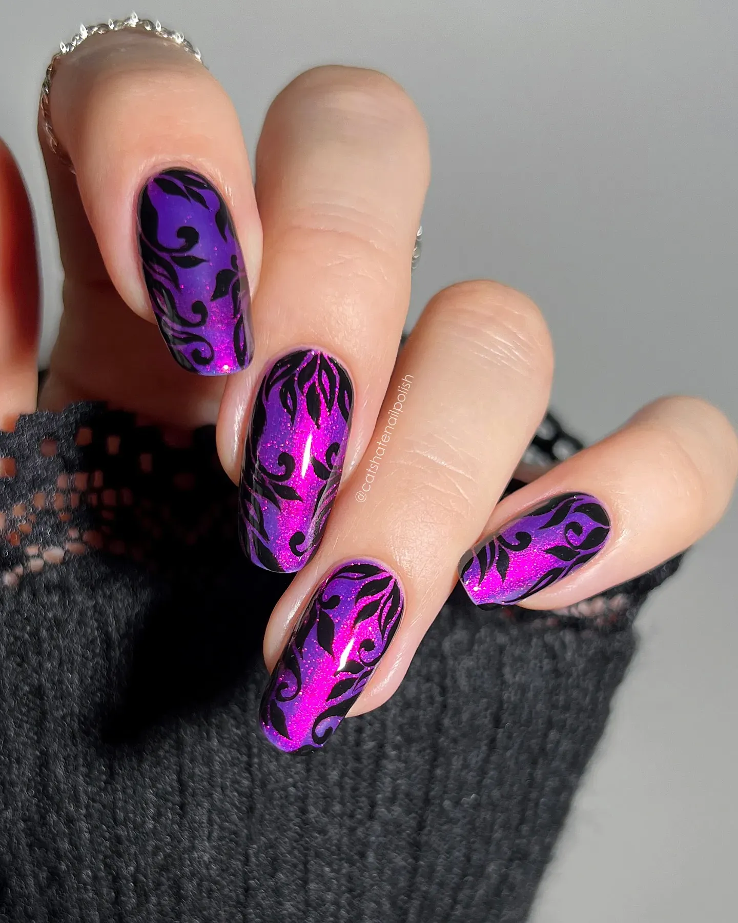 Dark meets dazzling with these deep purple nails featuring black filigree-style designs over a shimmery magenta base. They’re bold, artistic, and perfect for late-fall glam.
