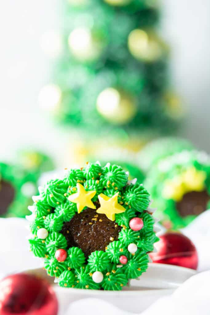 These Christmas wreath cupcakes are almost too pretty to eat! Decorated with green frosting and mini candies, they bring a touch of elegance and festivity to any dessert table.