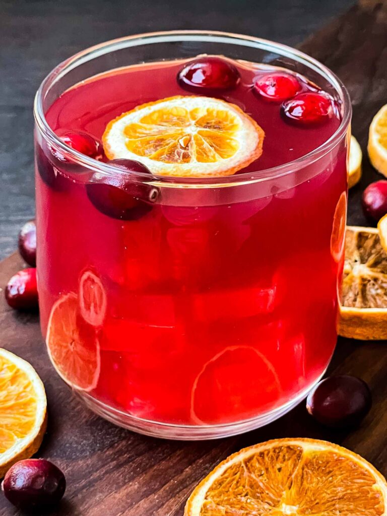 This cocktail combines cranberry flavors with vodka and orange liqueur for a tart, slightly sweet holiday sip. It’s a bright and festive drink to kick off your celebration!