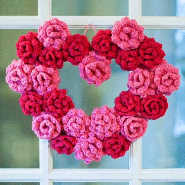 Brighten up your door with one of these gorgeous heart shaped crochet wreaths for Valentine's!