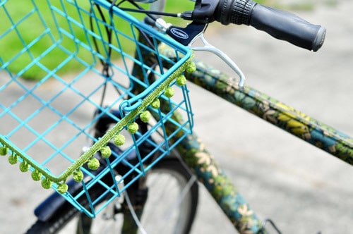 How to Decorate a Bike: Add a pom pom trim to your bike basket