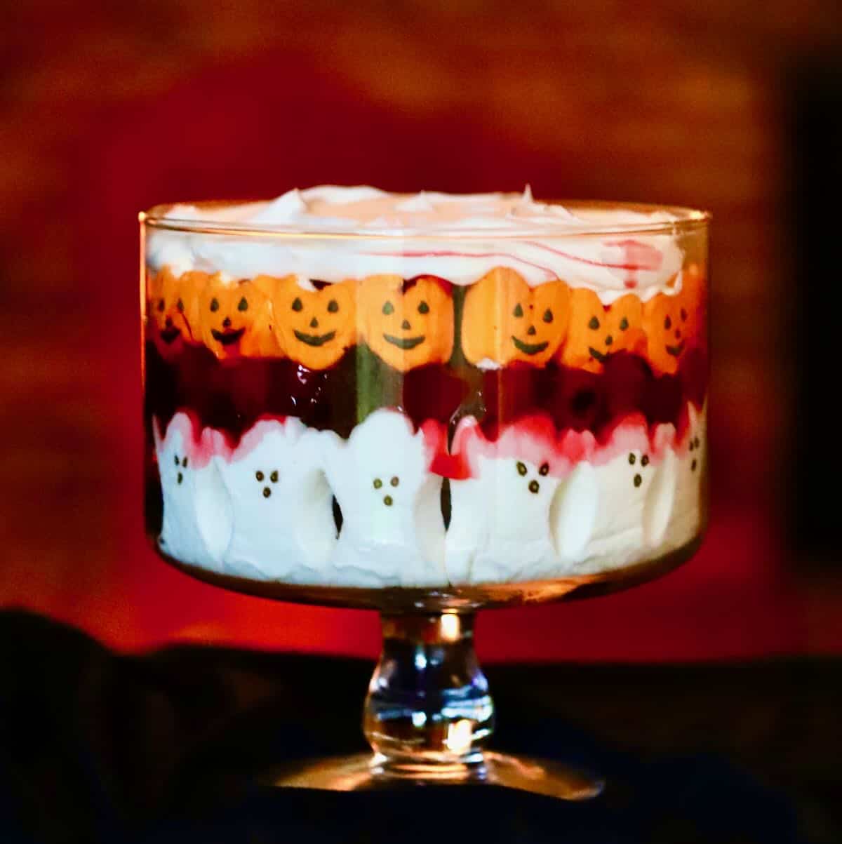 A spooky twist on a classic Black Forest cake, this trifle layers dark chocolate cake, cherry pie filling, and rich chocolate pudding for a decadent treat. With its dark and moody appearance, it’s the perfect dessert to bring a touch of elegance to your Halloween spread.