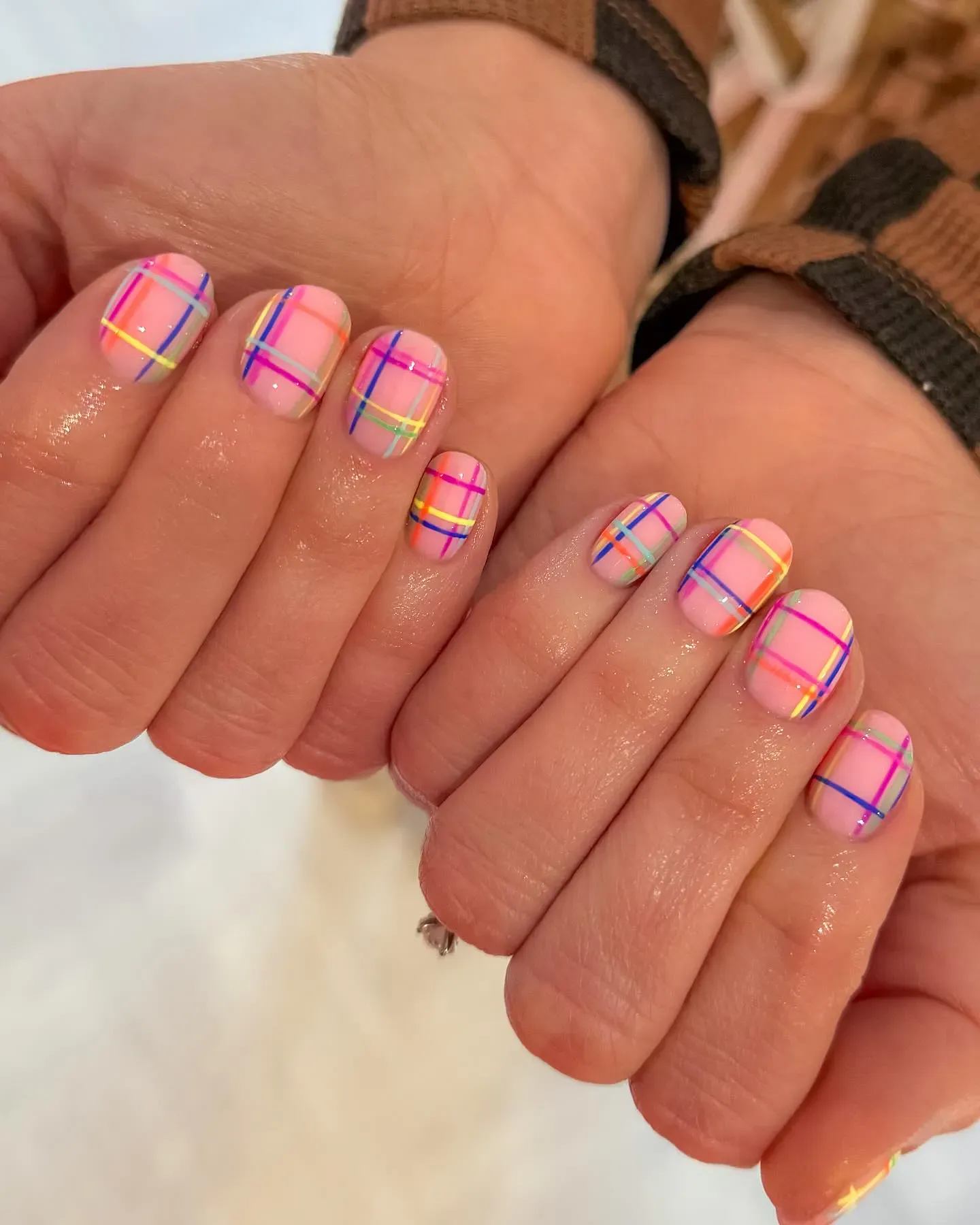 Bright neon stripes layered over a soft pink base — a cheerful, dopamine-boosting twist on classic plaid.