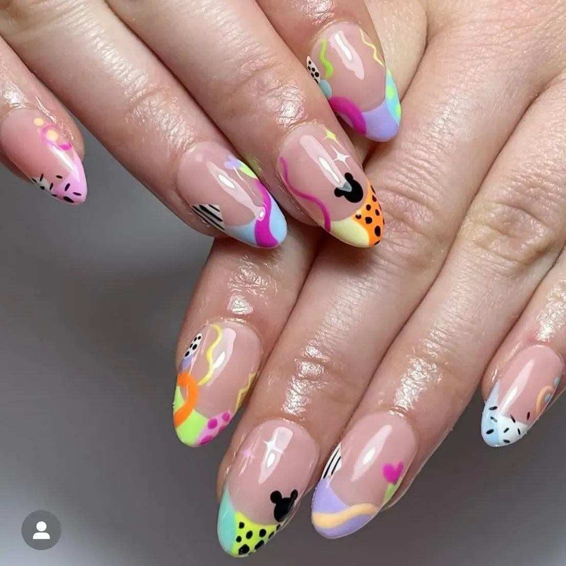 Bright, bold, and full of fun β these playful pastel French tips with hidden Mickeys are perfect for summer at the parks.