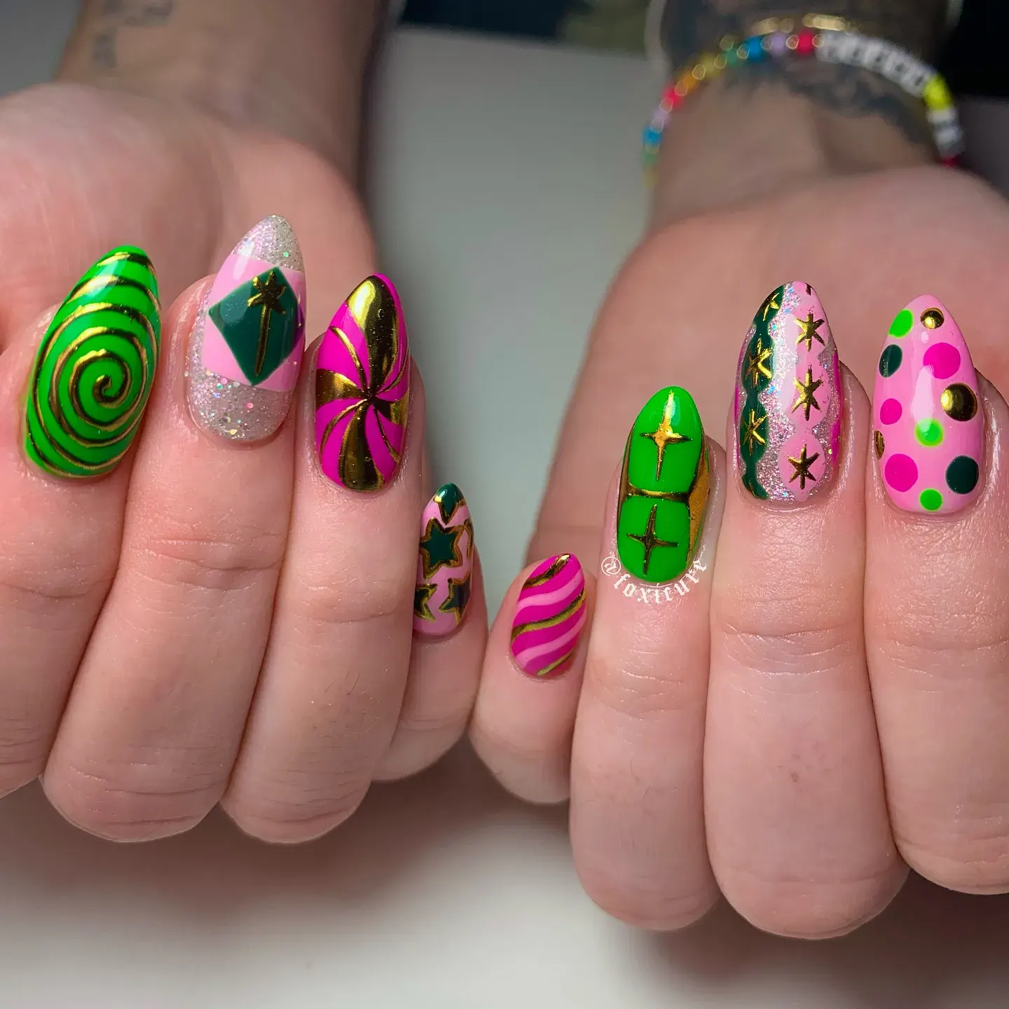 A playful mix of hot pink, lime green, and glossy gold stars — ideal for fans who want one Glinda hand and one Elphaba hand!