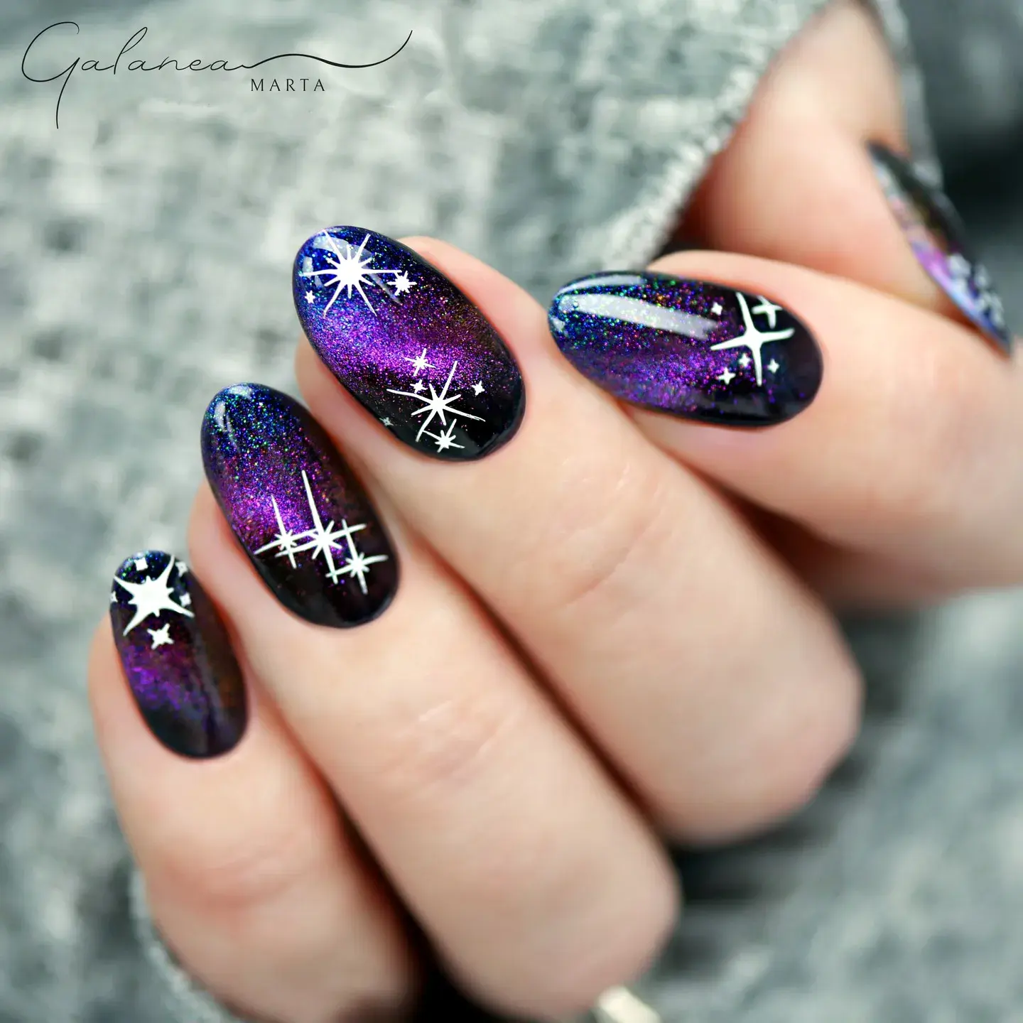 A galactic gradient of purple and black sets the stage for white shooting stars and constellations. This mystical nail design gives total goddess nails energy. ๐ ๐