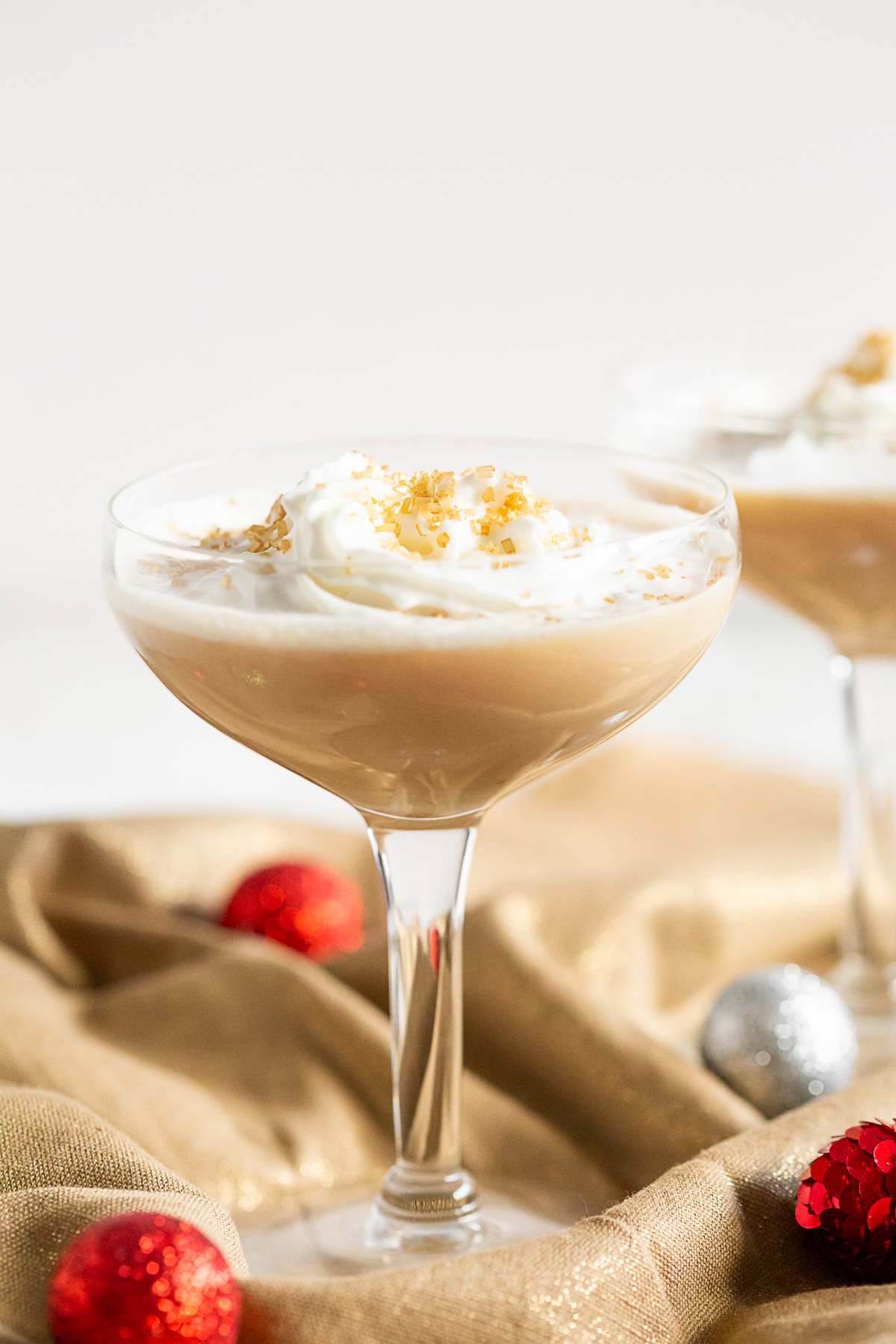 This dessert-like cocktail combines vodka, coffee liqueur, and a hint of gingerbread syrup. Top with whipped cream and a sprinkle of nutmeg for a fun Christmas cocktail.