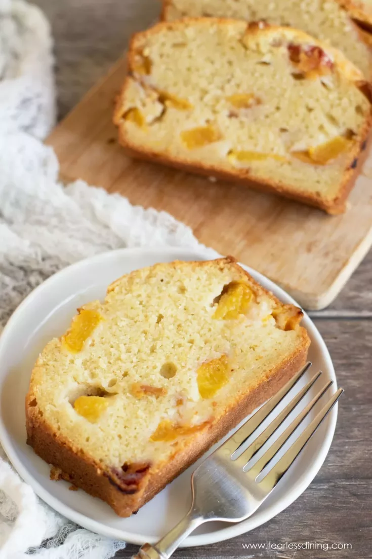 If you love fresh juicy peaches, this homemade gluten free peach cake is a recipe that you need to try! Each bite of this light fluffy cake is full of sweet chunks of peach. It is the perfect cake for summer!