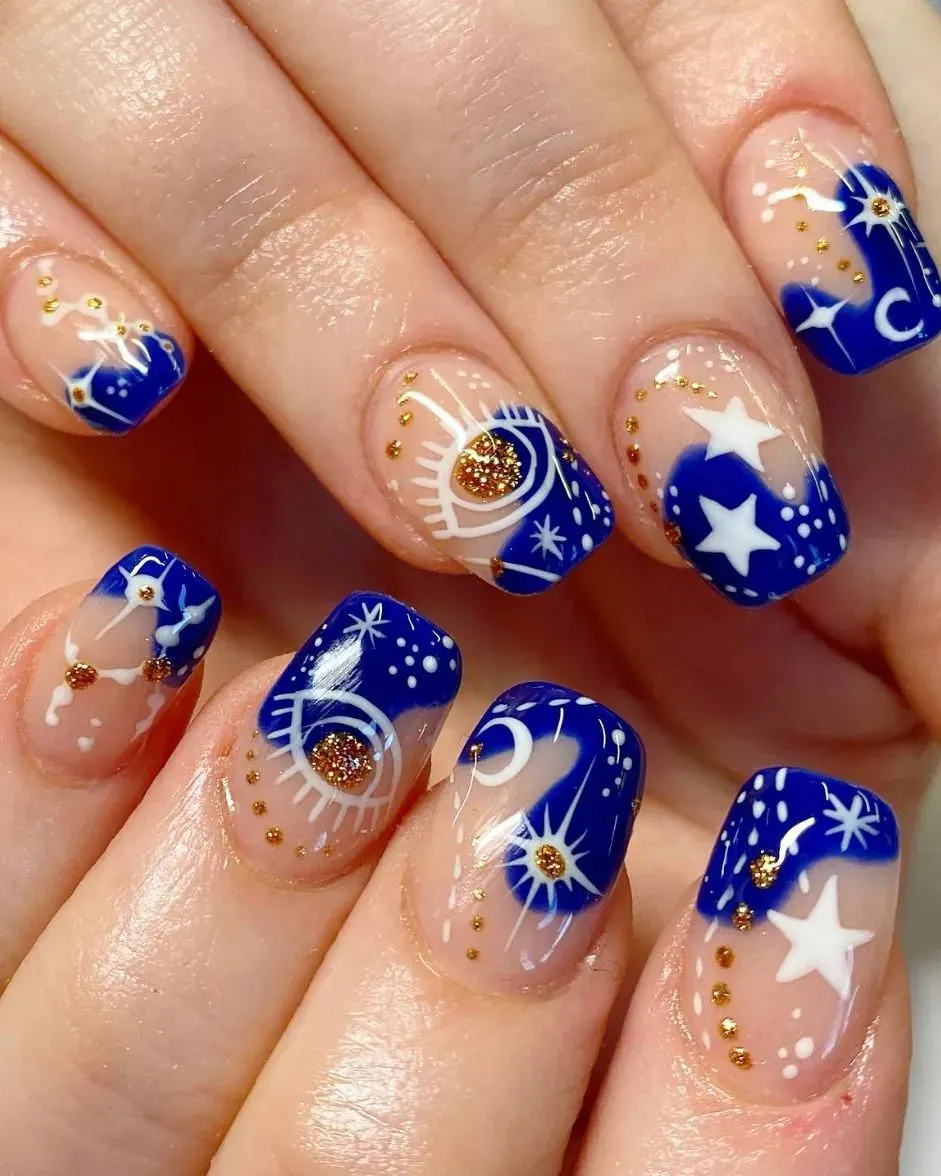 Royal blue polish with golden constellations and sun motifs brings serious goddess nail vibes โ ideal for anyone channeling cosmic energy and divine feminine style. ๐ซ๐