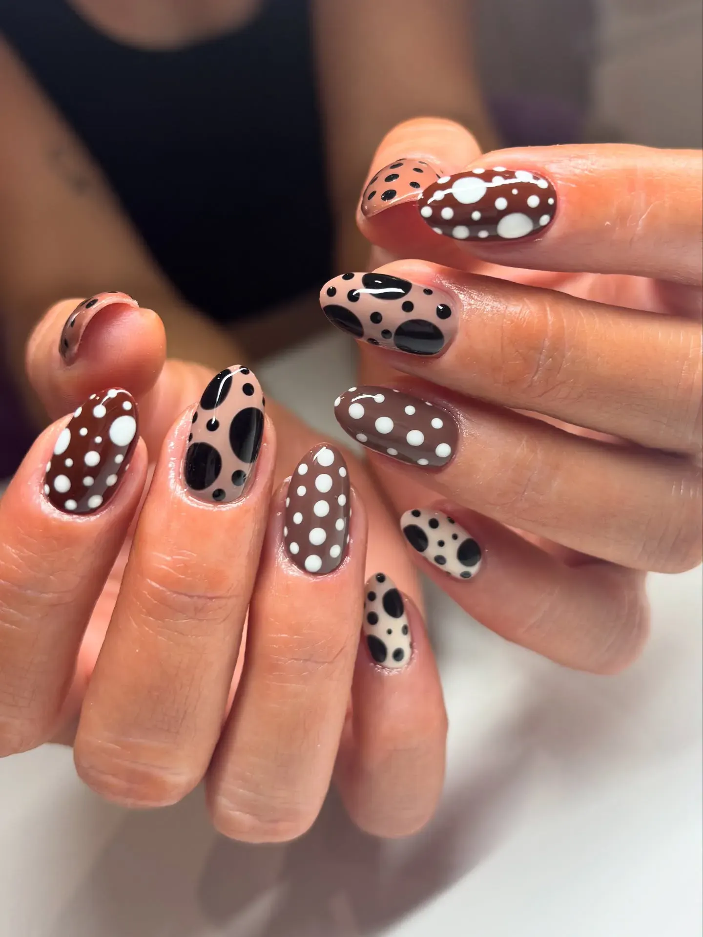 Different dot sizes and shades of brown and beige make this mani pop without being too matchy-matchy — playful, but still grown-up.