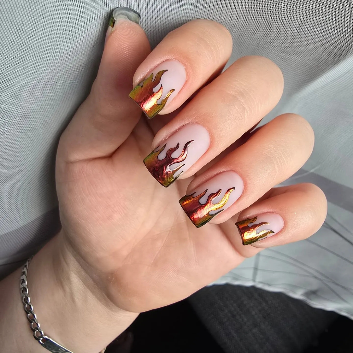 For a molten metal moment, check out @jennys_nailart__ and her reflective copper-and-gold flame tips. They catch the light beautifully and give instant fall nail inspo.