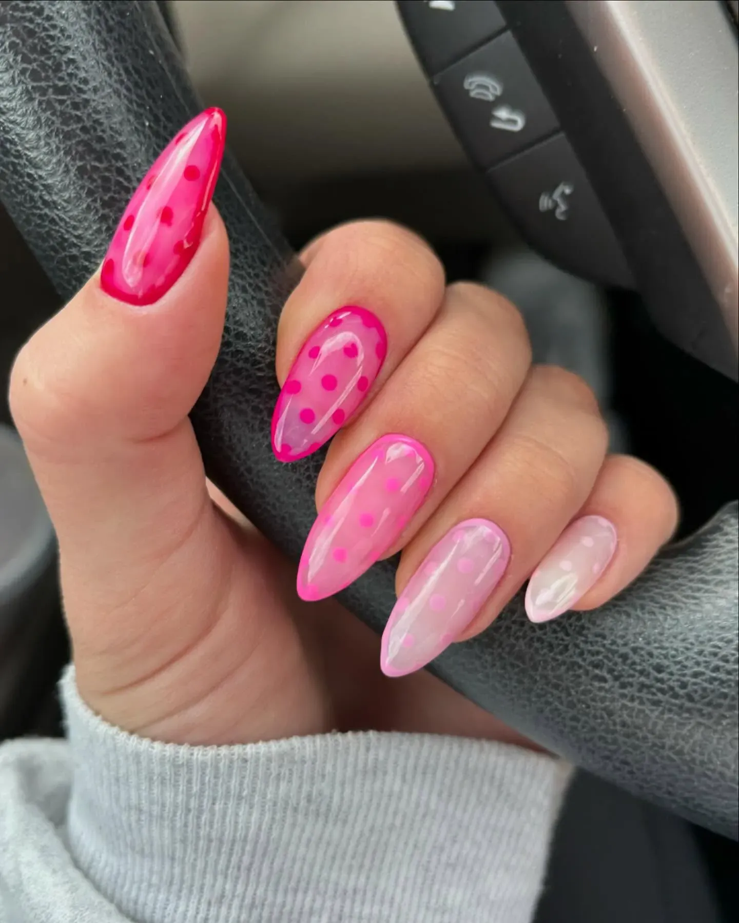 Simple, sleek, and seriously cute — this pink nail art design features a gradient of pinks with translucent layers and glossy dots. It’s giving modern Barbie meets effortless chic.