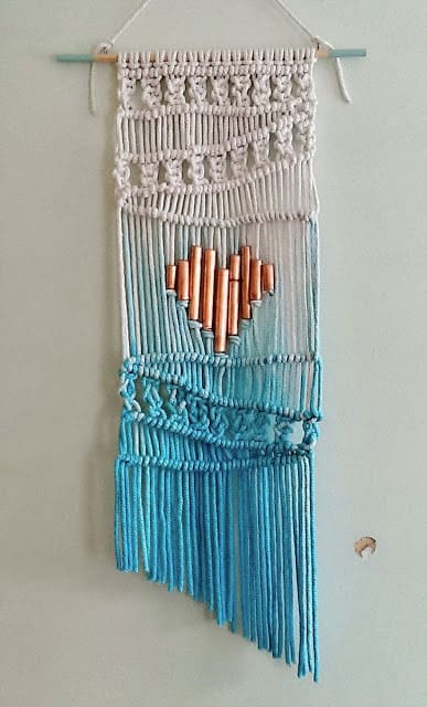 Make an ombre macrame wall hanging with a copper pipe heart.