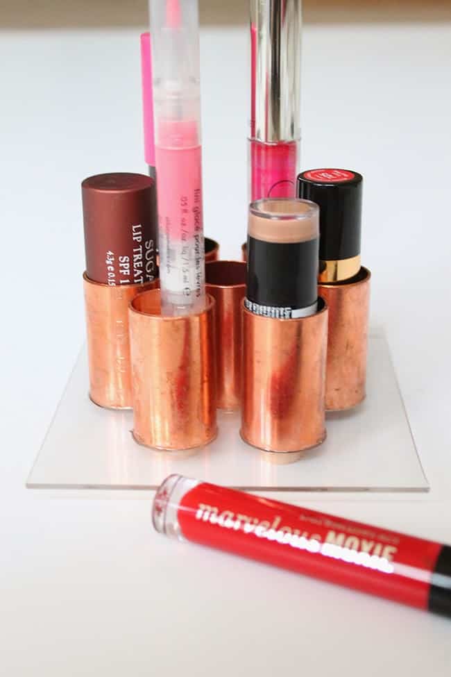 Store your lipsticks in this copper tube holder which is super simple to make